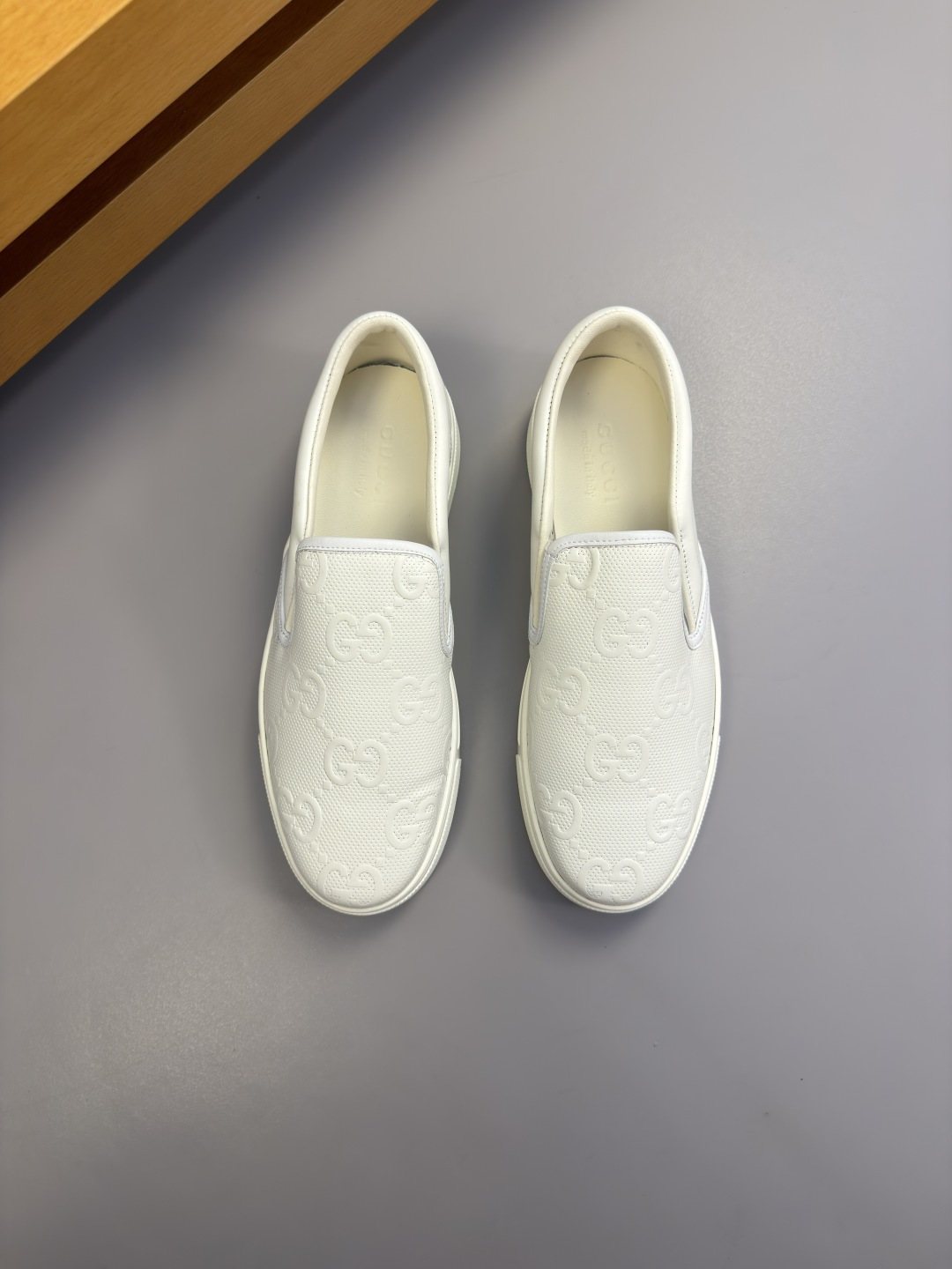 Ivory White Embossed Slip-On Sneakers — hero