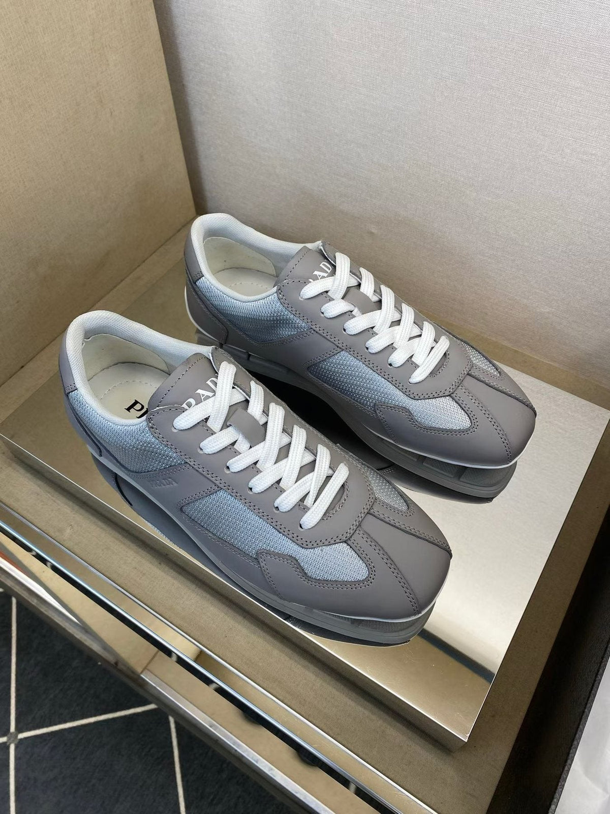 Prada Gray and White Low-Top Sneakers — front