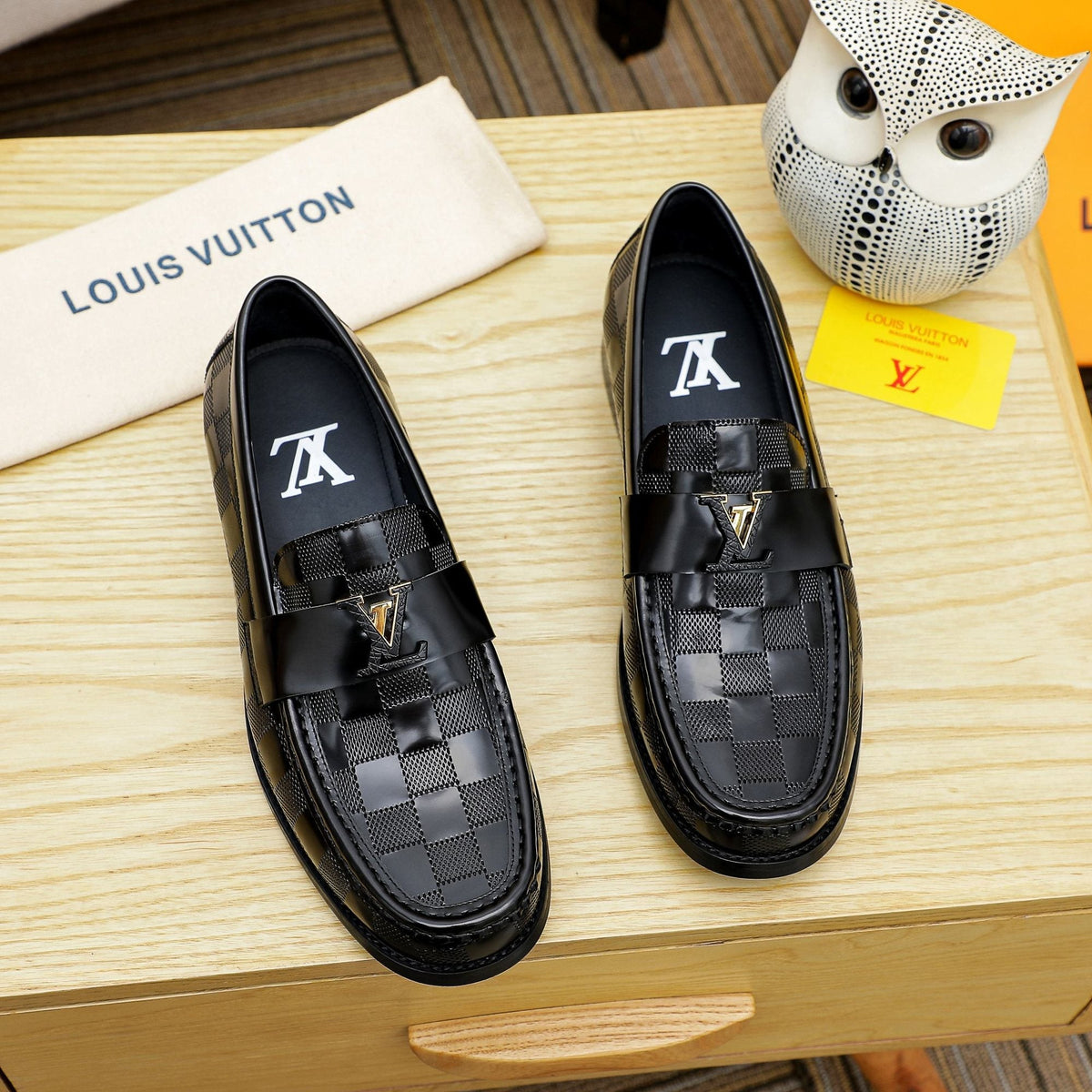 Louis Vuitton Black Woven Leather Loafers — hero
