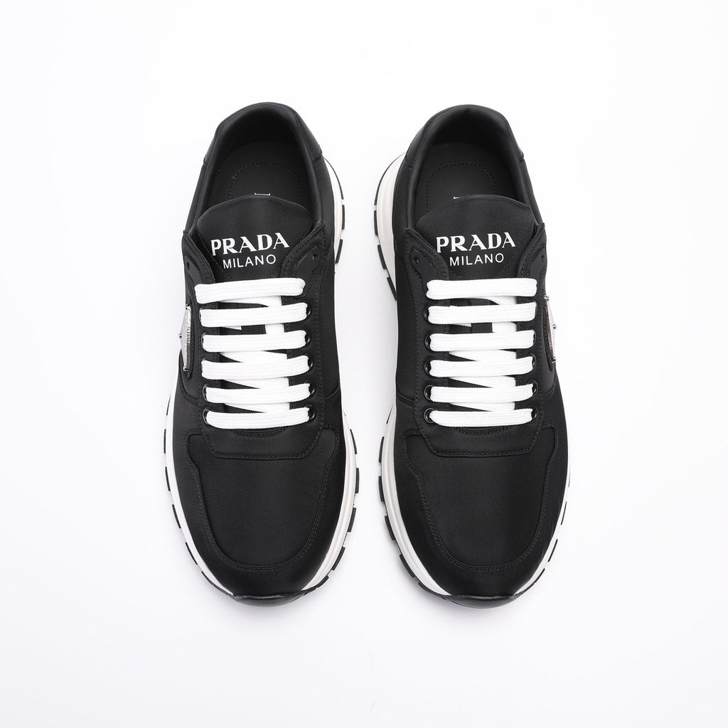 PRADA Navy Triangle Badge Sneakers — front